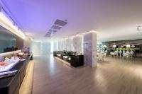 a restaurant with a buffet line in a room at Uya Motel in Xinwu