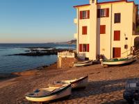 a group of boats parked next to a building at Hotel Villa Catarie in Guéthary