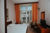 Postel nebo postele na pokoji v ubytování Hotel Central