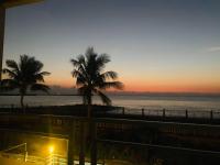 a view of the ocean at sunset from a balcony at HL Sea Homestay in Hualien City