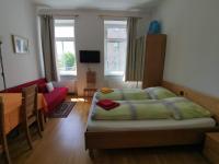 Televízia a/alebo spoločenská miestnosť v ubytovaní Apartments Hellwagstraße
