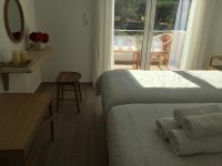 A bed or beds in a room at Oikia Ampavris