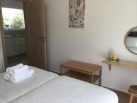 A bed or beds in a room at Oikia Ampavris