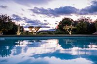 a pool of water with trees in the background at Villa Angel in La Gaude