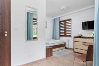 Łóżko lub łóżka w pokoju w obiekcie Apartamenty Krakowska