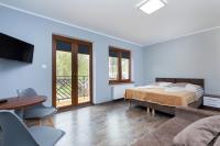 Łóżko lub łóżka w pokoju w obiekcie Apartamenty Krakowska
