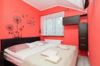 Łóżko lub łóżka w pokoju w obiekcie Apartamenty Krakowska