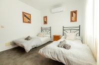 Łóżko lub łóżka w pokoju w obiekcie APARTAMENTO LUZ A