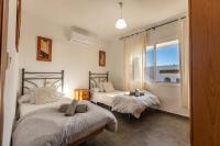 Łóżko lub łóżka w pokoju w obiekcie APARTAMENTO LUZ A