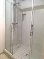 a shower with a glass door in a bathroom at Le bord de Loire in Basse-Indre