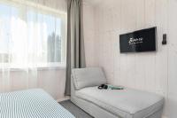 Televízia a/alebo spoločenská miestnosť v ubytovaní Bianco House Apartments