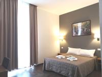 Posteľ alebo postele v izbe v ubytovaní Rome Travellers Hotel
