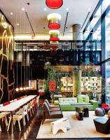 a lobby of a store with couches and tables at citizenM New York Times Square in New York