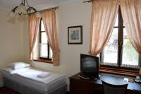Postel nebo postele na pokoji v ubytování Hotel Buchlovice