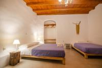 Postel nebo postele na pokoji v ubytování Dimitrakis Guesthouse
