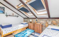 Posteľ alebo postele v izbe v ubytovaní Stone House Knez