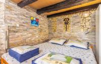 Posteľ alebo postele v izbe v ubytovaní Stone House Knez