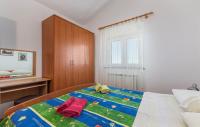 Posteľ alebo postele v izbe v ubytovaní Apartments Ulika