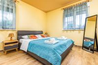 Posteľ alebo postele v izbe v ubytovaní Apartmani Monte