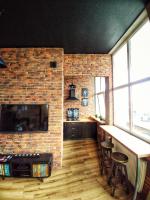 Televízia a/alebo spoločenská miestnosť v ubytovaní LOFT 57 CENTRUM