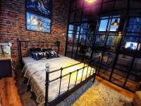 Posteľ alebo postele v izbe v ubytovaní LOFT 57 CENTRUM