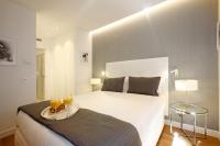 Postel nebo postele na pokoji v ubytování Gran Via Suites
