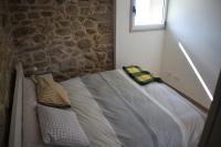 A bed or beds in a room at Pedra da Lan - una casita de piedra