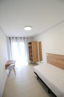 A bed or beds in a room at Apartamentos Gran Socaire de Noja