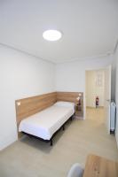 A bed or beds in a room at Apartamentos Gran Socaire de Noja