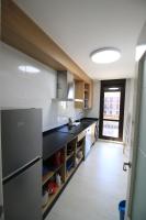 A kitchen or kitchenette at Apartamentos Gran Socaire de Noja