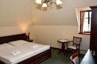Postel nebo postele na pokoji v ubytování Hotel Buchlovice