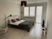 Posteľ alebo postele v izbe v ubytovaní APARTAMENT KILIŃSKIEGO 9