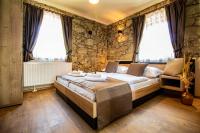 Postel nebo postele na pokoji v ubytování Residence Klažary u Žumberka