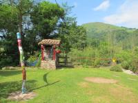 a garden with a gazebo in the grass at GITE IBARLA BORDA in Bidarray