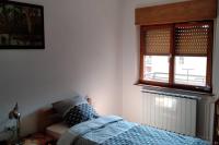 Postel nebo postele na pokoji v ubytování ZRM center