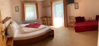 A bed or beds in a room at Pension Seeheim