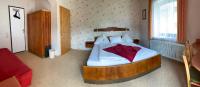 A bed or beds in a room at Pension Seeheim