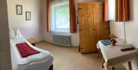 A bed or beds in a room at Pension Seeheim