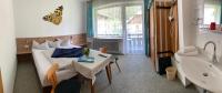 A bed or beds in a room at Pension Seeheim