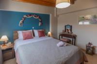Posteľ alebo postele v izbe v ubytovaní Nefeli seaview apartment