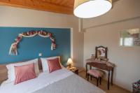 Posteľ alebo postele v izbe v ubytovaní Nefeli seaview apartment