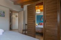 Posteľ alebo postele v izbe v ubytovaní Nefeli seaview apartment
