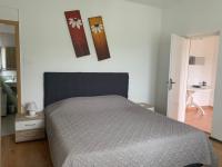 Postel nebo postele na pokoji v ubytování Apartmani Spomenka