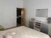 Postel nebo postele na pokoji v ubytování Apartmani Spomenka
