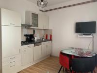 Kuchyň nebo kuchyňský kout v ubytování Apartmani Spomenka