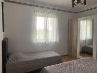 Postel nebo postele na pokoji v ubytování Apartmani Spomenka