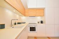 A kitchen or kitchenette at 70sqm private terrace in front of the sea & 107sqm brand new apartment