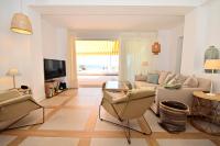A television and/or entertainment centre at 70sqm private terrace in front of the sea & 107sqm brand new apartment