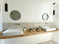 two white sinks on a counter in a bathroom at Villas de standing avec magnifique vue mer et piscines privées, Sagone in Sagone