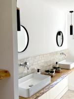 a white bathroom with two sinks and a mirror at Villas de standing avec magnifique vue mer et piscines privées, Sagone in Sagone